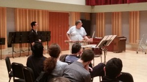 Zoltan Rácz demonstrates a point in "Rebonds b" by Iannis Xenakis to Eastman grad student, Darren Lin (standing left)