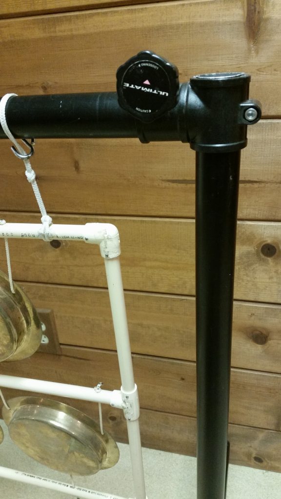 Photo 18 - Closeup of PVC frame/rack; note the bolt heads at each point where the conduit is attached to a fitting